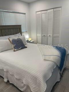 bedroom featuring wood finished floors