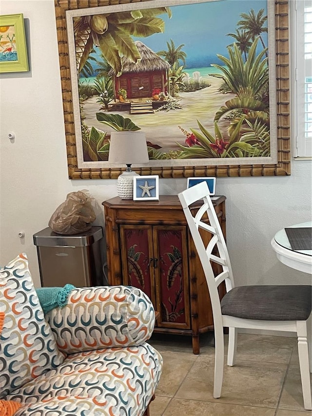 living area featuring tile patterned floors