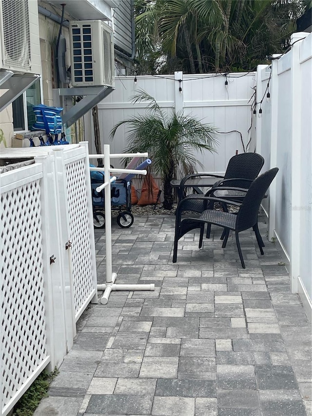 view of patio / terrace featuring a fenced backyard and cooling unit