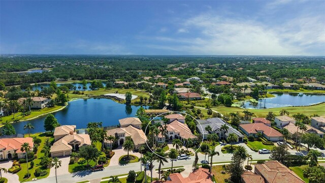 aerial view with a water view, a residential view, and golf course view