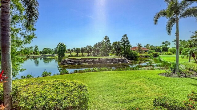 6819 Dominion Ln, Lakewood Ranch, FL 34202 - view of green lawn featuring a water view
