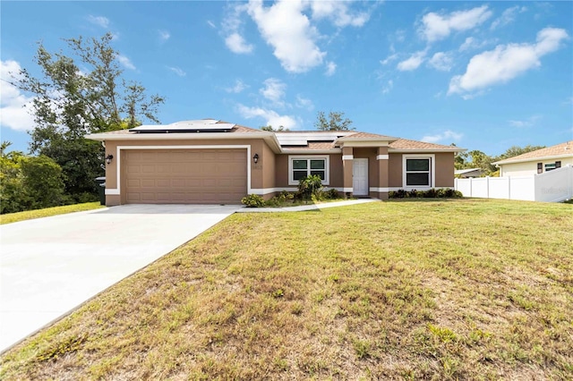 view of front of house featuring stucco siding, a garage, roof mounted solar panels, and concrete driveway