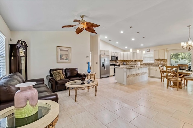 living room with lofted ceiling, a ceiling fan, a chandelier, recessed lighting, and light tile patterned floors