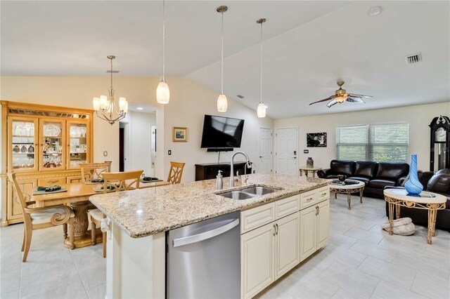 kitchen featuring a sink, dishwasher, open floor plan, lofted ceiling, and pendant lighting