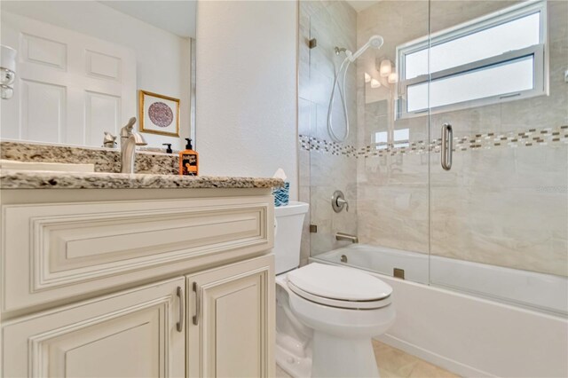 full bath featuring vanity, toilet, and tub / shower combination