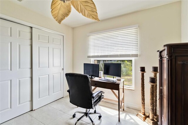 home office with light tile patterned floors