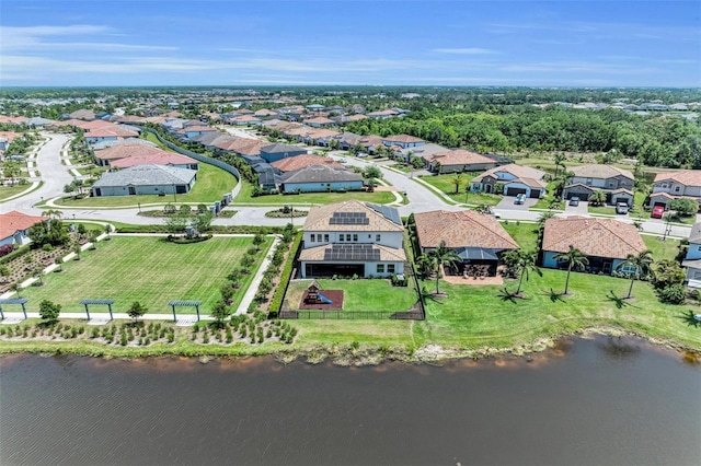 birds eye view of property with a residential view and a water view