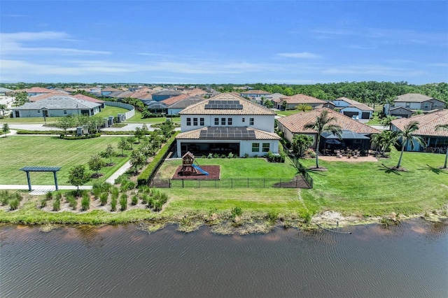 aerial view featuring a water view and a residential view
