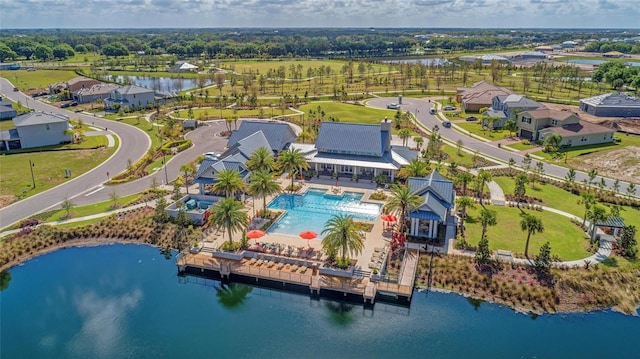 birds eye view of property with a water view
