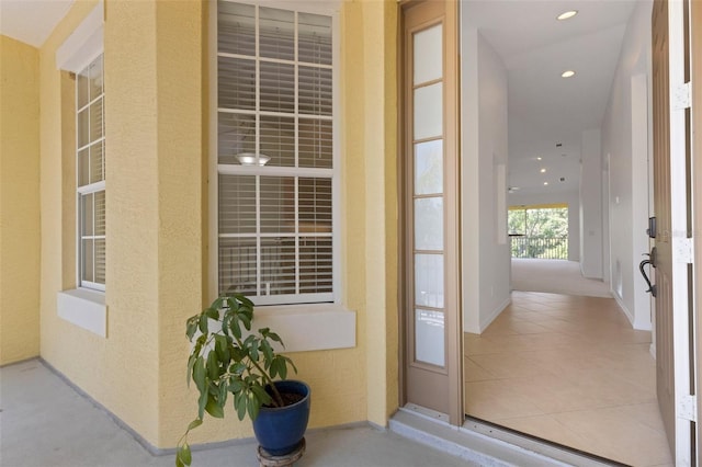 doorway to property with stucco siding