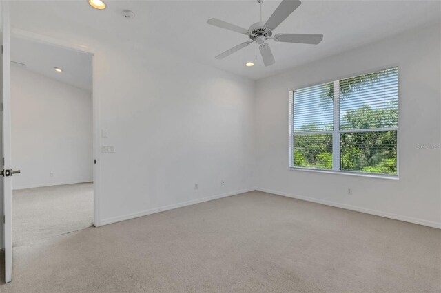 spare room with carpet floors, recessed lighting, baseboards, and ceiling fan