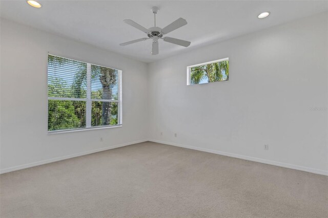 spare room with carpet floors, baseboards, recessed lighting, and ceiling fan