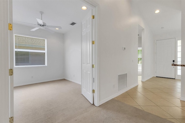 empty room with recessed lighting, light colored carpet, baseboards, and a ceiling fan