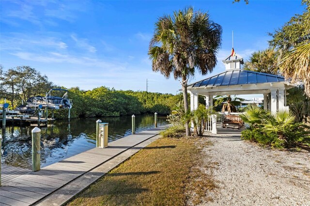 dock area featuring a gazebo and a water view