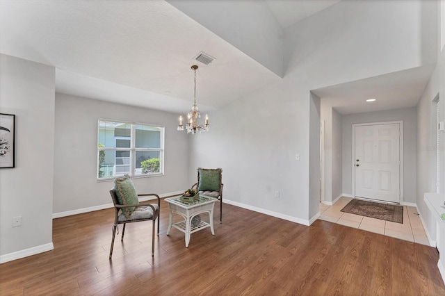 3007 Live Oak Ln, Palmetto, FL 34221 - entrance foyer with a chandelier, wood finished floors, and baseboards