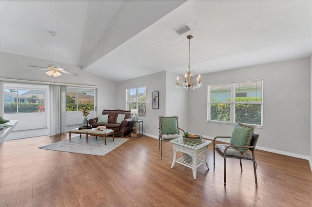 3007 Live Oak Ln, Palmetto, FL 34221 - sitting room with wood finished floors, lofted ceiling, a ceiling fan, baseboards, and a chandelier