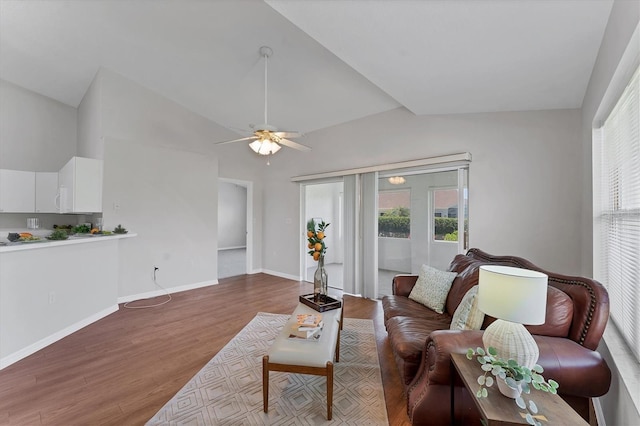 3007 Live Oak Ln, Palmetto, FL 34221 - living area featuring lofted ceiling, plenty of natural light, wood finished floors, a ceiling fan, and baseboards