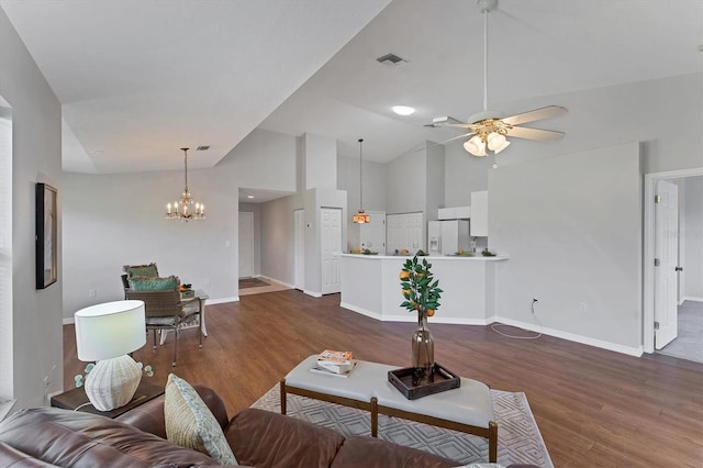 3007 Live Oak Ln, Palmetto, FL 34221 - living area with dark wood-type flooring, a ceiling fan, a chandelier, baseboards, and high vaulted ceiling