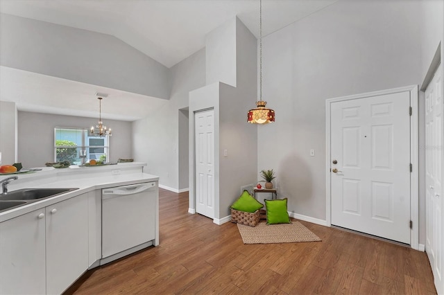 3007 Live Oak Ln, Palmetto, FL 34221 - kitchen featuring dishwasher, a sink, a chandelier, wood finished floors, and hanging light fixtures