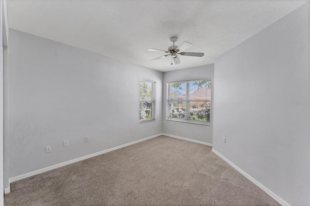 3007 Live Oak Ln, Palmetto, FL 34221 - spare room featuring ceiling fan, light carpet, baseboards, and a textured ceiling