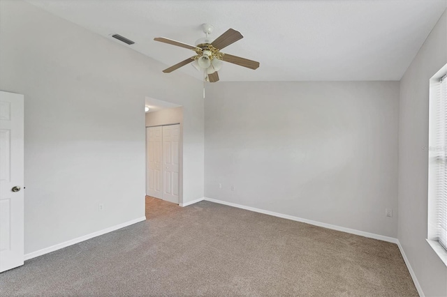 3007 Live Oak Ln, Palmetto, FL 34221 - spare room featuring carpet floors, ceiling fan, baseboards, and lofted ceiling