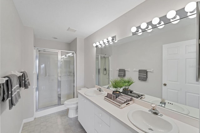 3007 Live Oak Ln, Palmetto, FL 34221 - full bath featuring a stall shower, toilet, double vanity, and baseboards