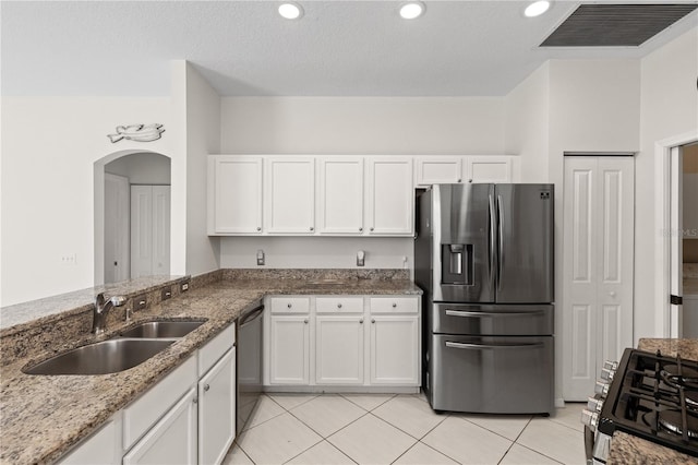 12014 Beeflower Dr, Lakewood Ranch, FL 34202 - kitchen featuring a sink, white cabinets, stainless steel appliances, and visible vents