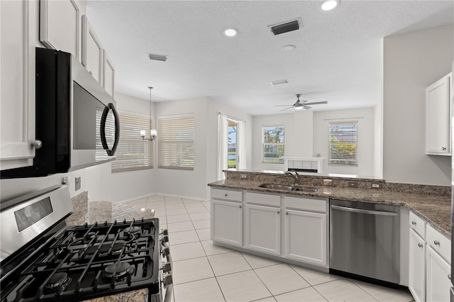 12014 Beeflower Dr, Lakewood Ranch, FL 34202 - kitchen featuring ceiling fan, visible vents, a sink, light tile patterned floors, and stainless steel appliances