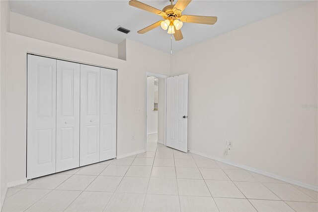12014 Beeflower Dr, Lakewood Ranch, FL 34202 - unfurnished bedroom with a ceiling fan, baseboards, visible vents, and a closet