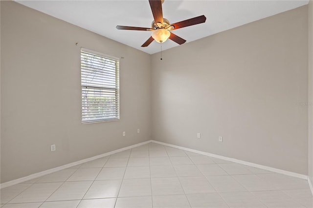 12014 Beeflower Dr, Lakewood Ranch, FL 34202 - empty room featuring light tile patterned floors, baseboards, and ceiling fan