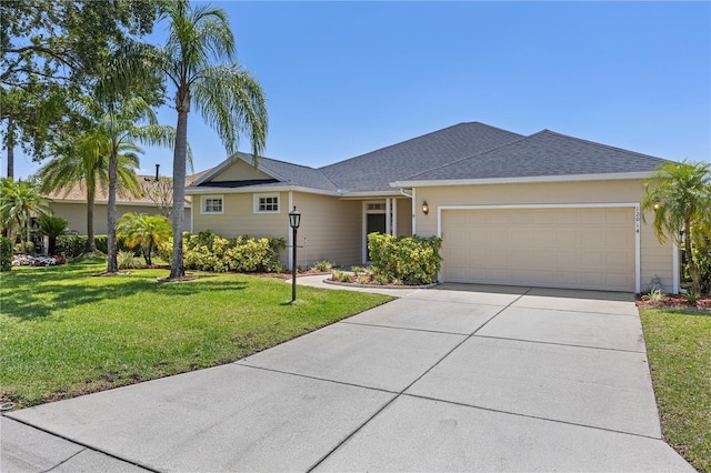 12014 Beeflower Dr, Lakewood Ranch, FL 34202 - ranch-style home with an attached garage, a shingled roof, a front lawn, and driveway