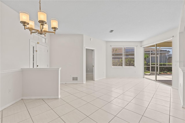 12014 Beeflower Dr, Lakewood Ranch, FL 34202 - unfurnished room featuring an inviting chandelier, light tile patterned floors, baseboards, and visible vents