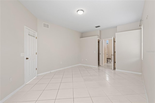 12014 Beeflower Dr, Lakewood Ranch, FL 34202 - empty room featuring visible vents, baseboards, and light tile patterned flooring