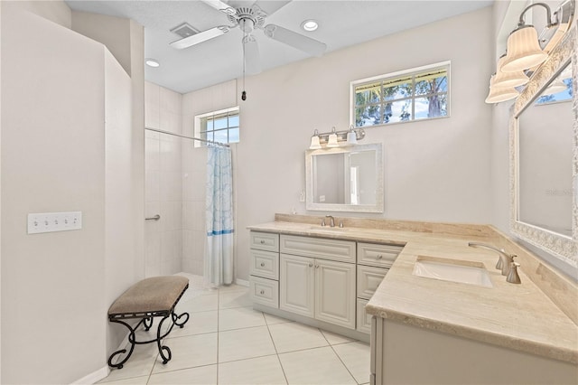 12014 Beeflower Dr, Lakewood Ranch, FL 34202 - bathroom with a sink, tile patterned floors, ceiling fan, and a tile shower