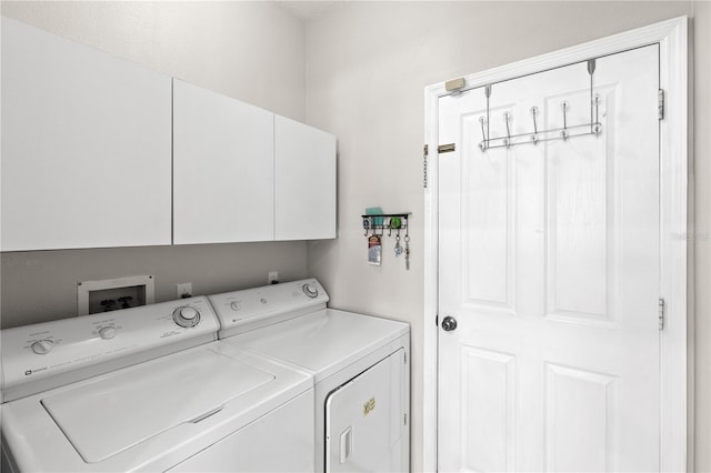12014 Beeflower Dr, Lakewood Ranch, FL 34202 - clothes washing area with cabinet space and washing machine and dryer