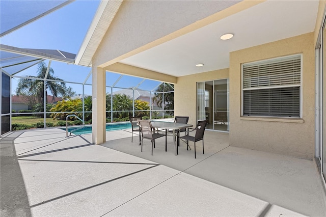 12014 Beeflower Dr, Lakewood Ranch, FL 34202 - view of patio with glass enclosure, outdoor dining area, and an outdoor pool