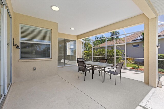 12014 Beeflower Dr, Lakewood Ranch, FL 34202 - sunroom / solarium featuring plenty of natural light and outdoor dining space