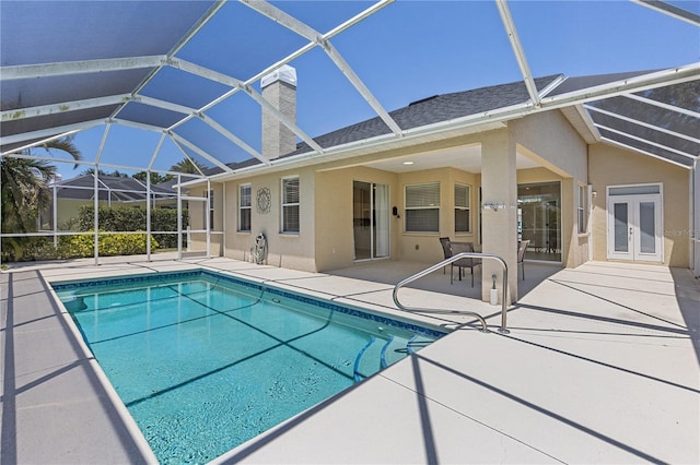 12014 Beeflower Dr, Lakewood Ranch, FL 34202 - outdoor pool featuring french doors, a patio, and a lanai