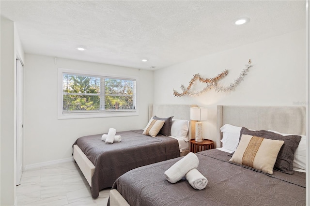 578-580 Companion Way, Longboat Key, FL 34228 - bedroom with recessed lighting, a textured ceiling, and marble finish floor