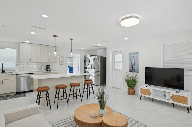 578-580 Companion Way, Longboat Key, FL 34228 - living area with visible vents, marble finish floor, stacked washer / dryer, and recessed lighting