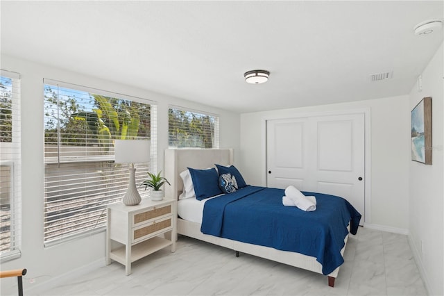 578-580 Companion Way, Longboat Key, FL 34228 - bedroom featuring marble finish floor, visible vents, a closet, and multiple windows