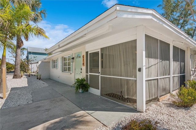578-580 Companion Way, Longboat Key, FL 34228 - exterior space featuring a patio and a sunroom
