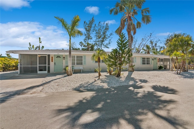 578-580 Companion Way, Longboat Key, FL 34228 - rear view of property featuring a sunroom and stucco siding