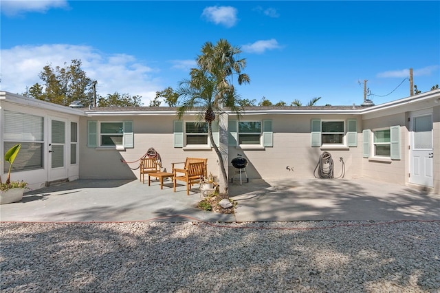 578-580 Companion Way, Longboat Key, FL 34228 - back of house with a patio and concrete block siding