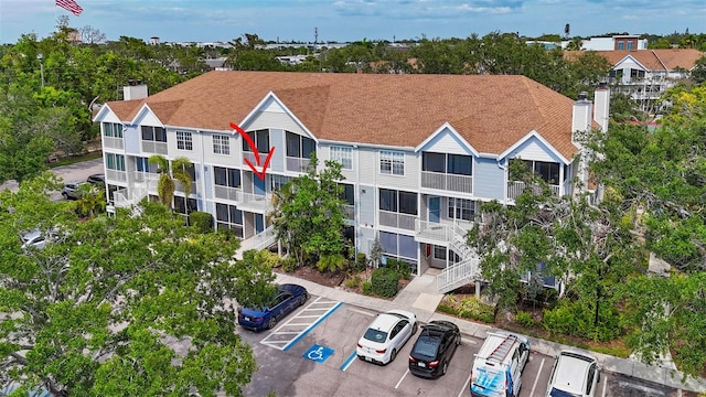 view of property featuring uncovered parking