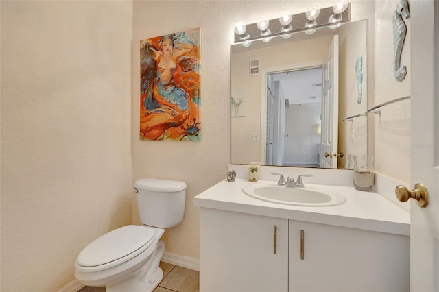 half bath featuring toilet, vanity, visible vents, tile patterned flooring, and baseboards