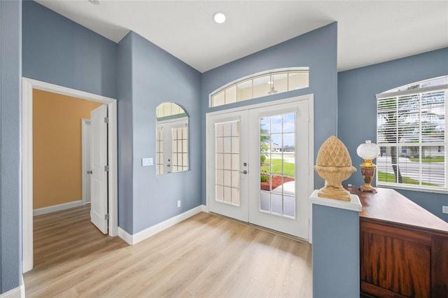 9106 Yarberry St, Sarasota, FL 34240 - entryway with baseboards, french doors, and wood finished floors
