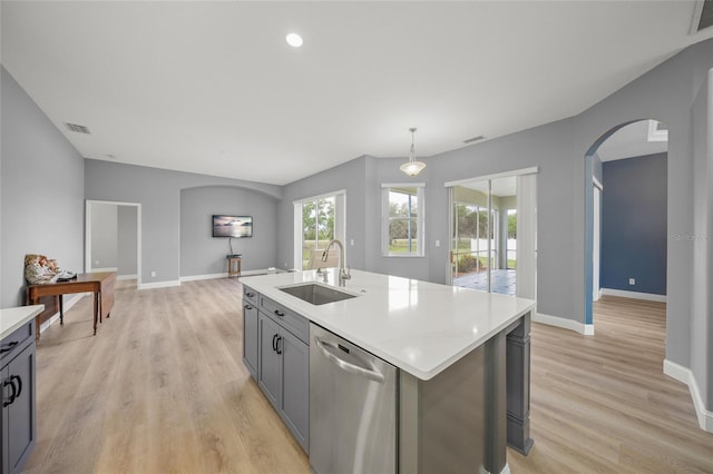 9106 Yarberry St, Sarasota, FL 34240 - kitchen featuring a sink, visible vents, arched walkways, stainless steel dishwasher, and baseboards