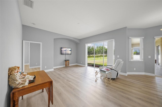 9106 Yarberry St, Sarasota, FL 34240 - living area with light wood finished floors, baseboards, and visible vents