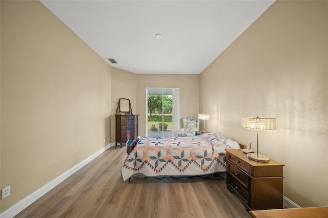 9106 Yarberry St, Sarasota, FL 34240 - bedroom with baseboards, visible vents, and wood finished floors